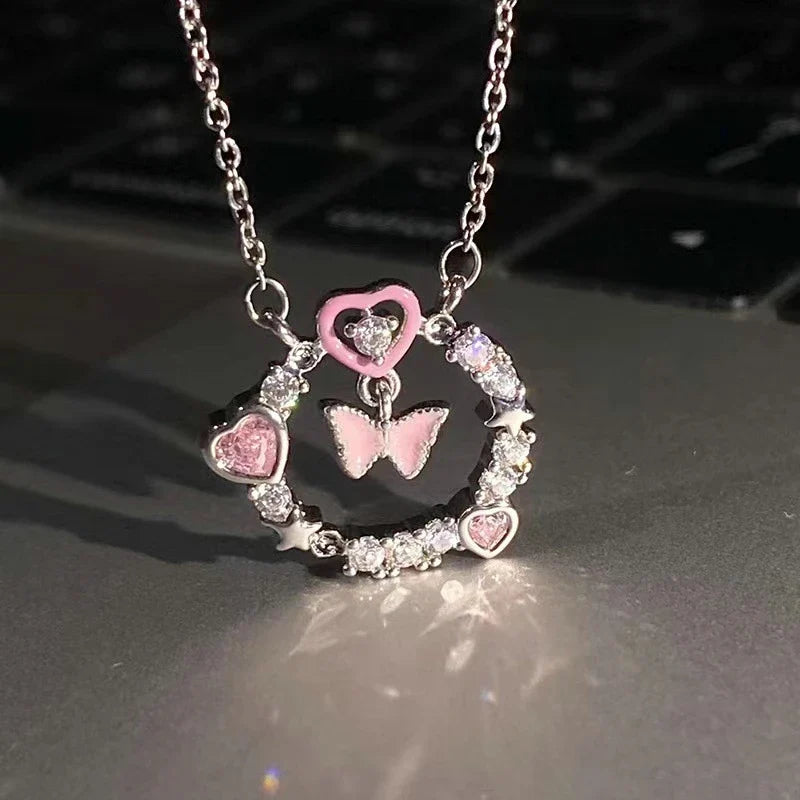 Collar con Dije Planeta y Corazón Rosa con Zirconia