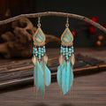 Aros Largos Boho con Pluma y Borlas
