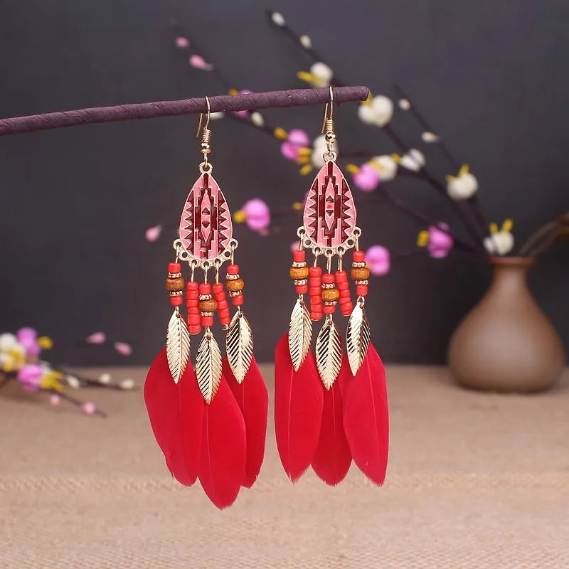 Aros Largos Boho con Pluma y Borlas